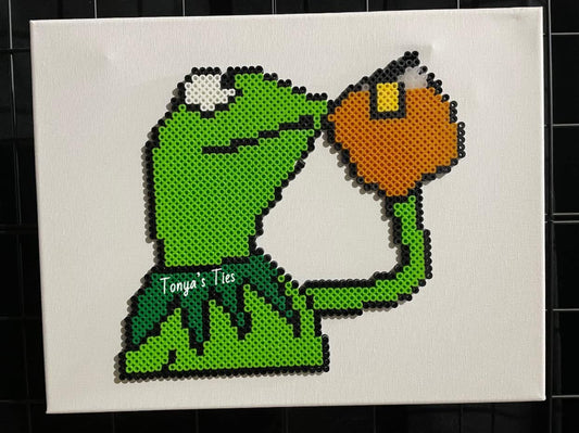 Frog drinking tea